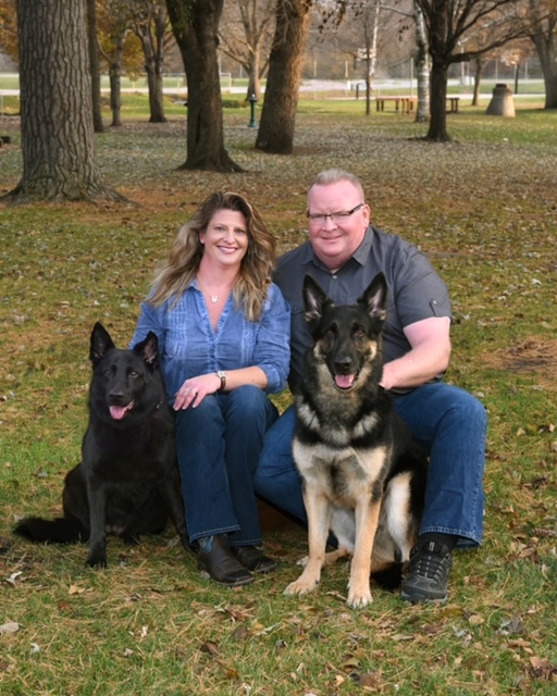 Keith and Toni with their two german shepard dogs